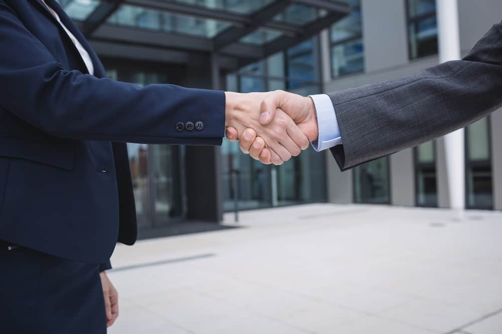 Close-up of businesspeople shaking hands